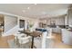 Open concept kitchen with island and stainless steel appliances at 131 Bennett Farm Dr, Loganville, GA 30052
