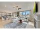 Open living space featuring a sectional sofa, fireplace, and large windows at 131 Bennett Farm Dr, Loganville, GA 30052