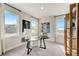 Home office with a desk, window, and built-in shelving at 131 Bennett Farm Dr, Loganville, GA 30052
