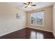 Bedroom with hardwood floors and window with shutters at 2617 Jupiter Sw Dr, Powder Springs, GA 30127