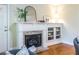 White fireplace mantel with built-in shelving and gas fireplace at 1228 Morton Trce, Atlanta, GA 30316