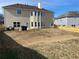 View of the home's back elevation and backyard at 1238 Polk Xing, Mcdonough, GA 30252