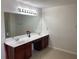 Double vanity bathroom with large mirror and tile floors at 1238 Polk Xing, Mcdonough, GA 30252
