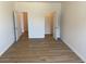 Spacious bedroom with hardwood floors and walk-in closet at 1238 Polk Xing, Mcdonough, GA 30252