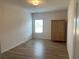 Bright bedroom with hardwood floors and neutral walls at 1238 Polk Xing, Mcdonough, GA 30252