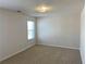 Bedroom with carpet, neutral walls and two windows at 1238 Polk Xing, Mcdonough, GA 30252