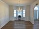 Formal dining room with wainscoting and a chandelier at 1238 Polk Xing, Mcdonough, GA 30252