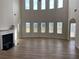 Two story Gathering room with hardwood floors and fireplace at 1238 Polk Xing, Mcdonough, GA 30252