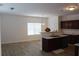 Kitchen with dark wood cabinets, island, and breakfast area at 1238 Polk Xing, Mcdonough, GA 30252