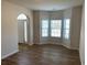 Bright living room with bay windows and hardwood floors at 1238 Polk Xing, Mcdonough, GA 30252