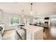 Large kitchen island with seating and stainless steel dishwasher at 2362 Browns Mill Se Rd, Atlanta, GA 30315