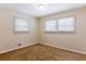 Well-lit bedroom with neutral decor and carpeted floor at 2617 Miriam Ln, Decatur, GA 30032