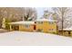 Snow-covered Ranch home with red door and attached carport at 2617 Miriam Ln, Decatur, GA 30032