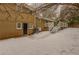 Back exterior view of house with deck and snow-covered yard at 2617 Miriam Ln, Decatur, GA 30032