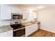 Newly remodeled kitchen with granite countertops and stainless steel appliances at 2617 Miriam Ln, Decatur, GA 30032
