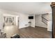 Open living room with hardwood floors, looking toward dining room at 145 Douglas Fir Ct, Johns Creek, GA 30022