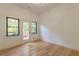 Spacious bedroom with wood floors and access to a deck at 3840 Wieuca Ne Ter, Atlanta, GA 30342