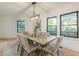 Light-filled dining area with wood table and six chairs at 3840 Wieuca Ne Ter, Atlanta, GA 30342