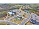 Aerial view featuring a community center with tennis, bocce ball and pool at 4941 Adler Ct, Hoschton, GA 30548