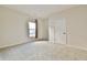 Bedroom featuring neutral walls, carpet flooring, and a window for natural light at 4941 Adler Ct, Hoschton, GA 30548
