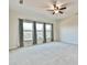 Spacious bedroom with three large windows and carpet floors at 4941 Adler Ct, Hoschton, GA 30548