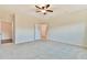 Spacious bedroom featuring a ceiling fan, neutral walls, and plush carpeting at 4941 Adler Ct, Hoschton, GA 30548