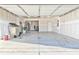 Spacious garage with high ceilings, an open layout, and plenty of room for parking and storage at 4941 Adler Ct, Hoschton, GA 30548