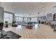 The gym includes treadmills, elliptical trainers, stationary bikes, and weight machines with neutral walls and light wood flooring at 4941 Adler Ct, Hoschton, GA 30548