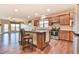 Open kitchen with a center island, stainless steel appliances, and hardwood floors is ideal for entertaining at 4941 Adler Ct, Hoschton, GA 30548