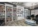 A well-stocked library with floor-to-ceiling bookshelves and comfortable seating for reading and relaxation at 4941 Adler Ct, Hoschton, GA 30548