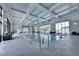 The indoor pool is surrounded by large windows offering an abundance of natural light with lounge chairs placed around the area at 4941 Adler Ct, Hoschton, GA 30548