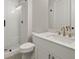 Bathroom with white vanity, quartz countertop and shower at 507 Pearl St, Cumming, GA 30040