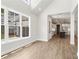 Bright dining room with hardwood floors and views of the kitchen at 507 Pearl St, Cumming, GA 30040