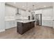 Modern kitchen with white cabinets, quartz countertops and island at 507 Pearl St, Cumming, GA 30040