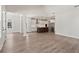Open floorplan showcasing kitchen and living room areas with hardwood floors at 507 Pearl St, Cumming, GA 30040