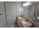 Updated bathroom with double vanity and granite countertop at 1334 To Lani Farm Rd, Stone Mountain, GA 30083