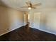 Spacious bedroom with hardwood floors and access to another room at 1334 To Lani Farm Rd, Stone Mountain, GA 30083