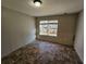 Simple bedroom with tile floor and large window at 1334 To Lani Farm Rd, Stone Mountain, GA 30083