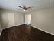 Bedroom with dark hardwood floors and a ceiling fan at 1334 To Lani Farm Rd, Stone Mountain, GA 30083