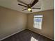 Well-lit bedroom with ceiling fan and carpet flooring at 1334 To Lani Farm Rd, Stone Mountain, GA 30083