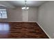 Dining room with dark wood laminate flooring and a chandelier at 1334 To Lani Farm Rd, Stone Mountain, GA 30083