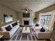 Cozy living room with fireplace, comfortable seating, and stylish decor at 1334 To Lani Farm Rd, Stone Mountain, GA 30083
