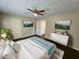 Spacious main bedroom with hardwood floors, ceiling fan and large windows at 1334 To Lani Farm Rd, Stone Mountain, GA 30083