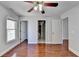 Hardwood floor bedroom with multiple doors and a window at 2084 Nelms Pointe Lndg, Lawrenceville, GA 30043