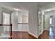 Upstairs hallway with hardwood floors and access to bedrooms at 2084 Nelms Pointe Lndg, Lawrenceville, GA 30043