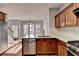 Modern kitchen with island, stainless steel appliances, and hardwood floors at 2084 Nelms Pointe Lndg, Lawrenceville, GA 30043