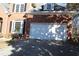 Two-car garage with white door and brick exterior at 2335 Corbett Ct, Powder Springs, GA 30127