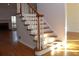 Elegant staircase with wood and white accents at 2335 Corbett Ct, Powder Springs, GA 30127