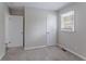 Well-lit bedroom with carpet floors and double closets at 3426 Glensford Dr, Decatur, GA 30032