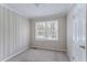 Cozy bedroom with wood-paneled walls and neutral carpet at 3426 Glensford Dr, Decatur, GA 30032